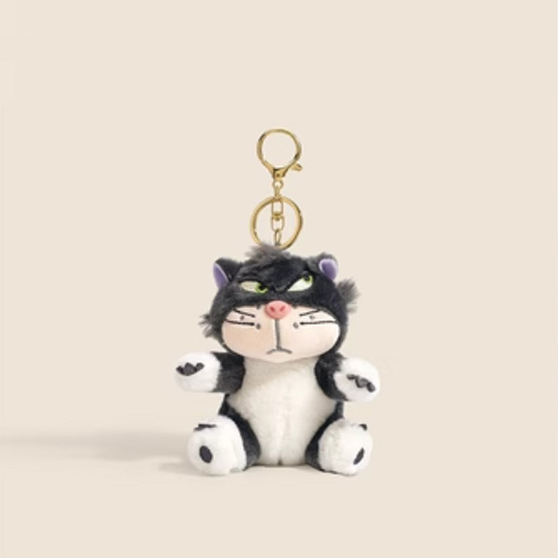 Charcoal black and white grumpy cat plush keychain charm with gold lobster-claw clasp, green eyes, and pink nose