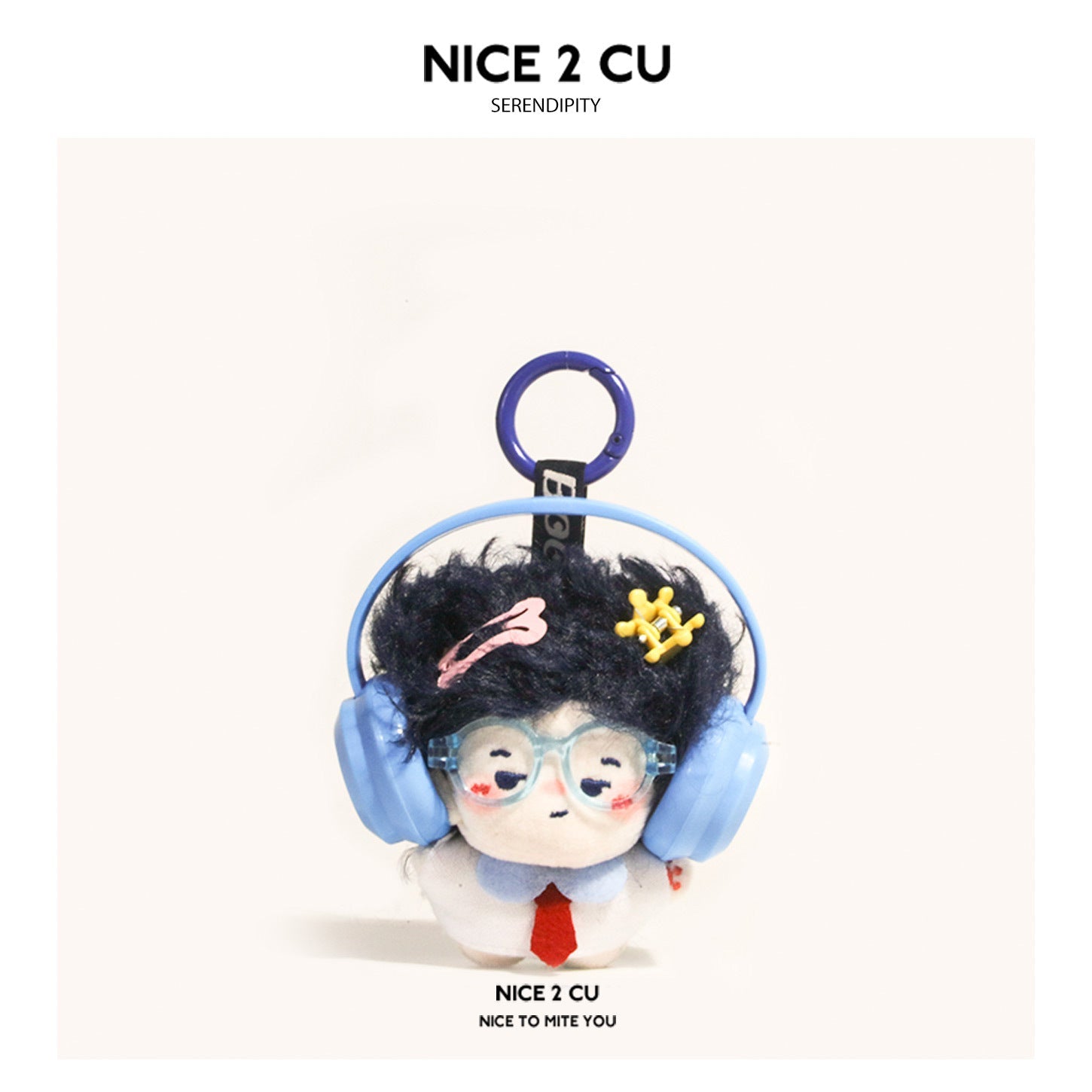 Chibi plush charm with dark hair, light blue glasses, and blue over-ear headphones