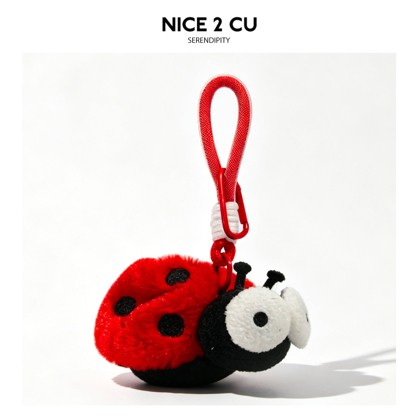 Red ladybug plush keychain with black spots, white eyes, and red hanging loop