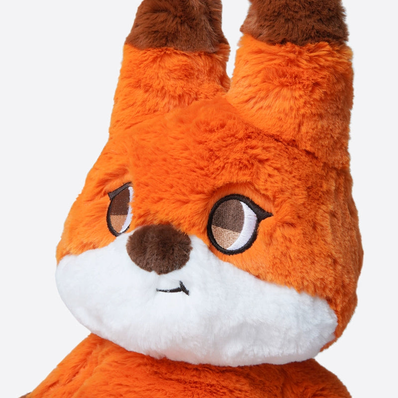 Close-up of the ZEIO Fox Plush Toy 42cm – a soft, large stuffed animal with big brown-and-white eyes, a brown nose, white fur around its mouth and lower face, and a fluffy tail.