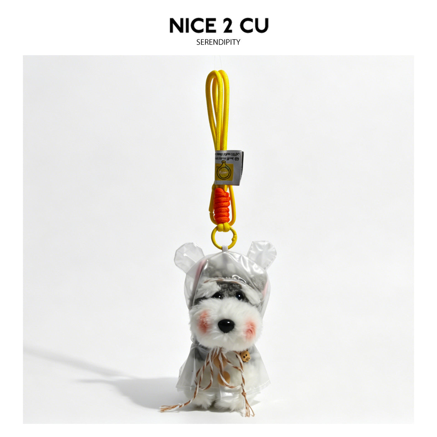 Schnauzer plush keychain charm wearing a clear transparent hooded raincoat with brown tassel and braided yellow lanyard