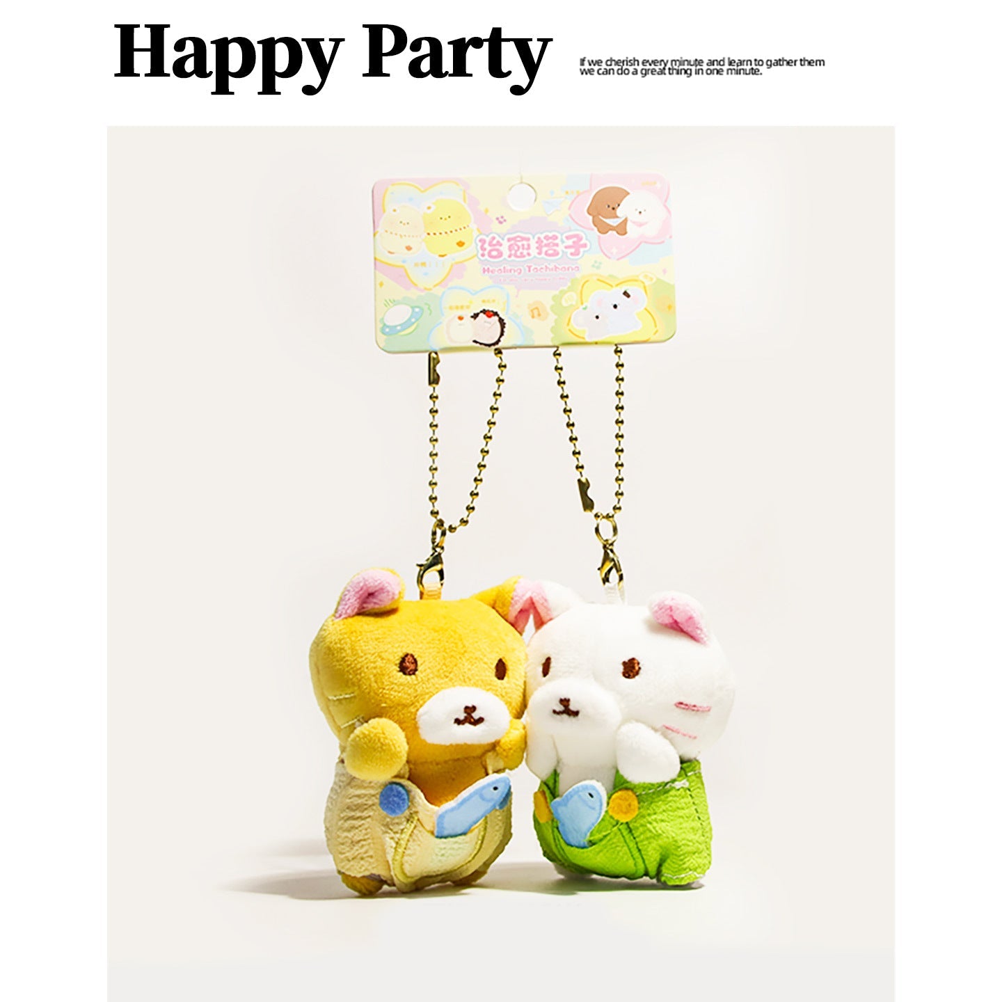 Pair of kawaii plush cat charms — yellow and white cats with pink inner ears and fish-detail bottoms on gold ball chains