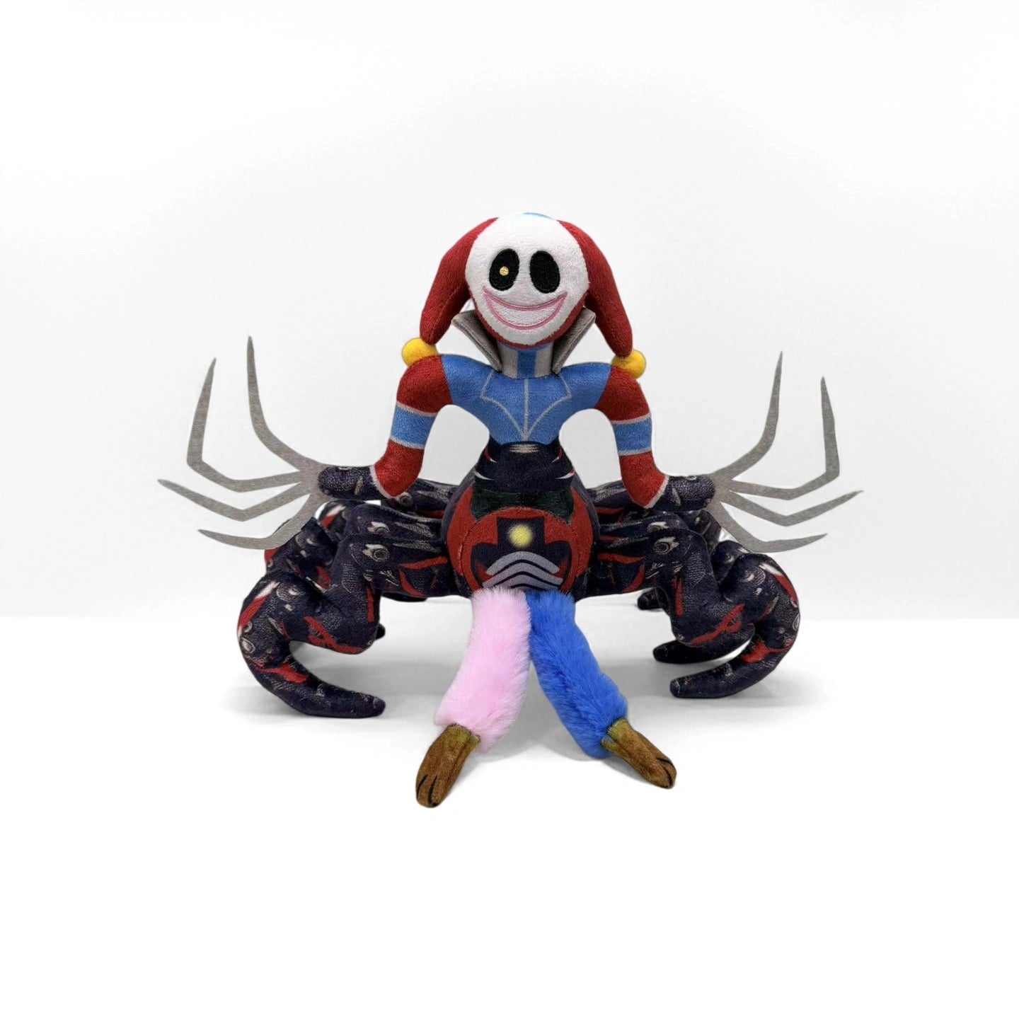 The ZoDoll Prototype Plush Poppy Playtime Horror Spider Monster is a 32cm soft stuffed toy featuring a smiling, masked figure in a multicolored outfit with a spider body and six black legs, inspired by Poppy Playtime.