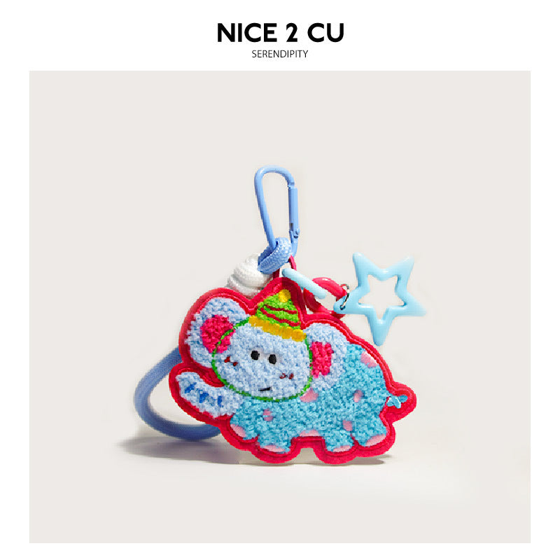 Embroidered light blue and pink elephant bag charm with star pendant and blue carabiner clip