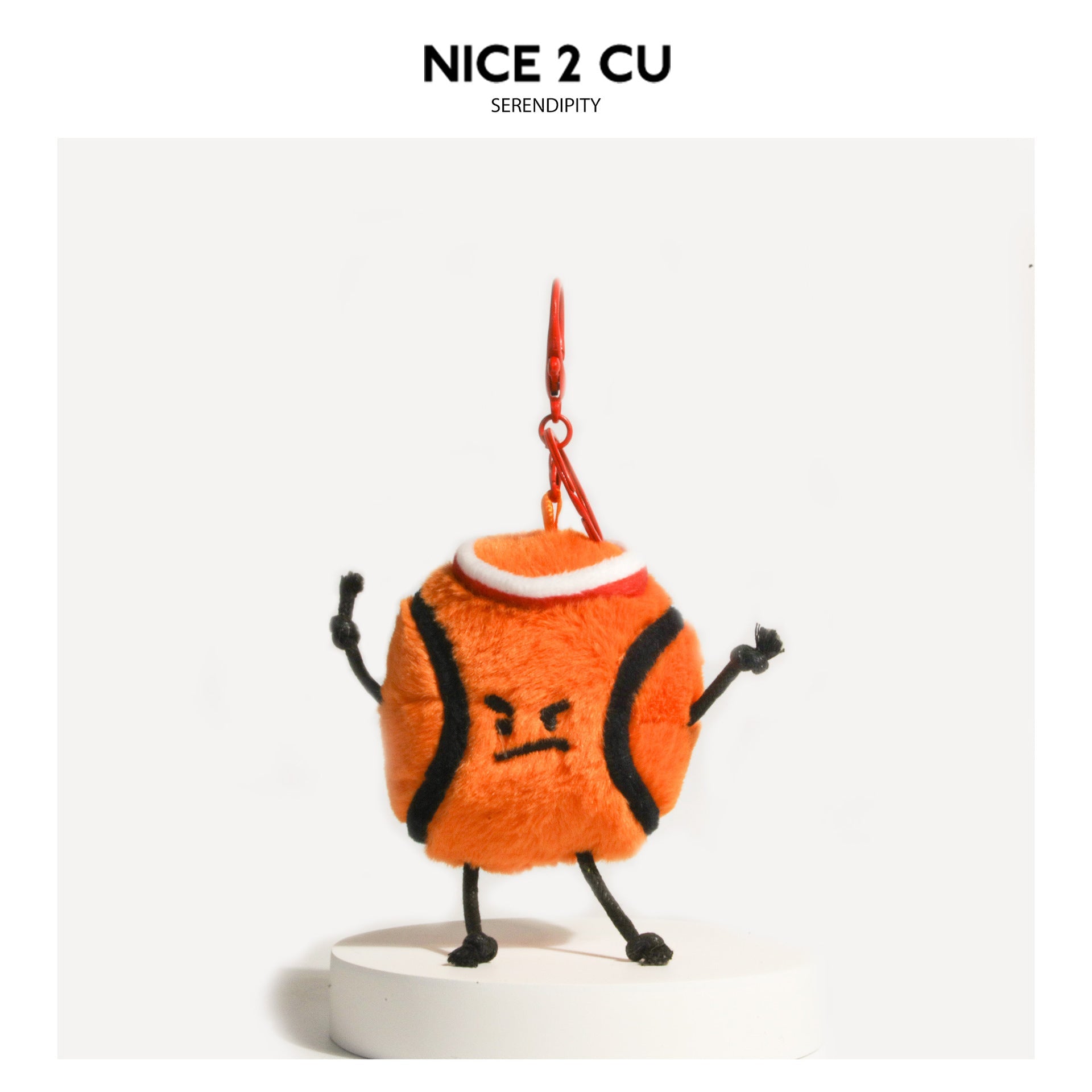 Orange-red tennis ball plush keychain charm with embroidered angry face, black cord limbs, and metal clip on top