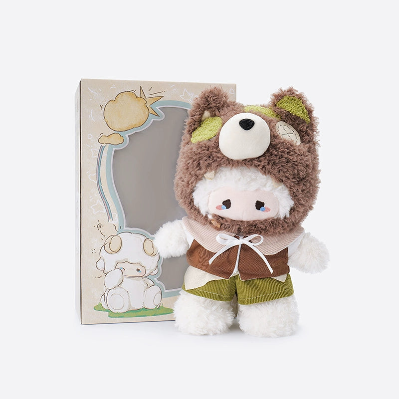 The ZEIO Sheep-Costume Lamb Plush Toy (29cm) features a lamb doll in a bear hood and green shorts, displayed before its illustrated box. This adorable hooded plush with fluffy ears makes a cute nursery décor piece.