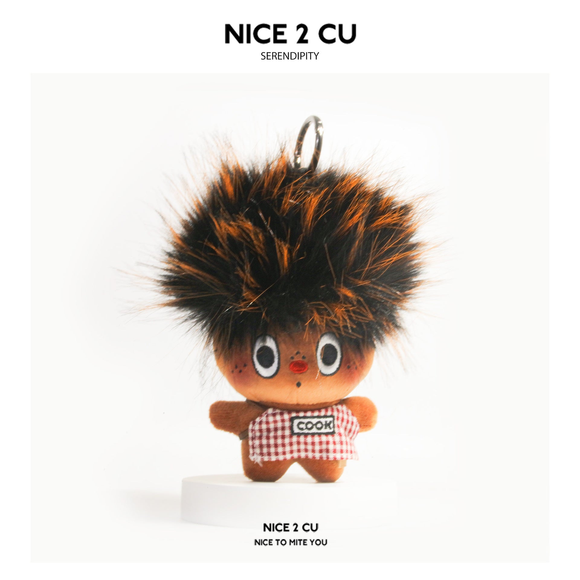 Red-brown scorched chef plush keychain with spiky frizzy hair and red-and-white checkered COOK outfit