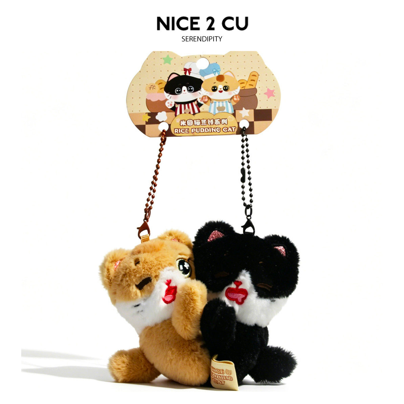 Rice Pudding Cat plush keychain pair — tan tabby and black tuxedo cat charms with red heart detail and ball-chain clasps on b