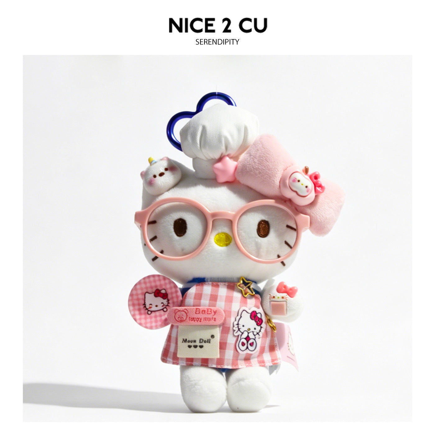Kawaii cat plush charm in pink gingham apron dress with glasses and cat-shaped plate accessory