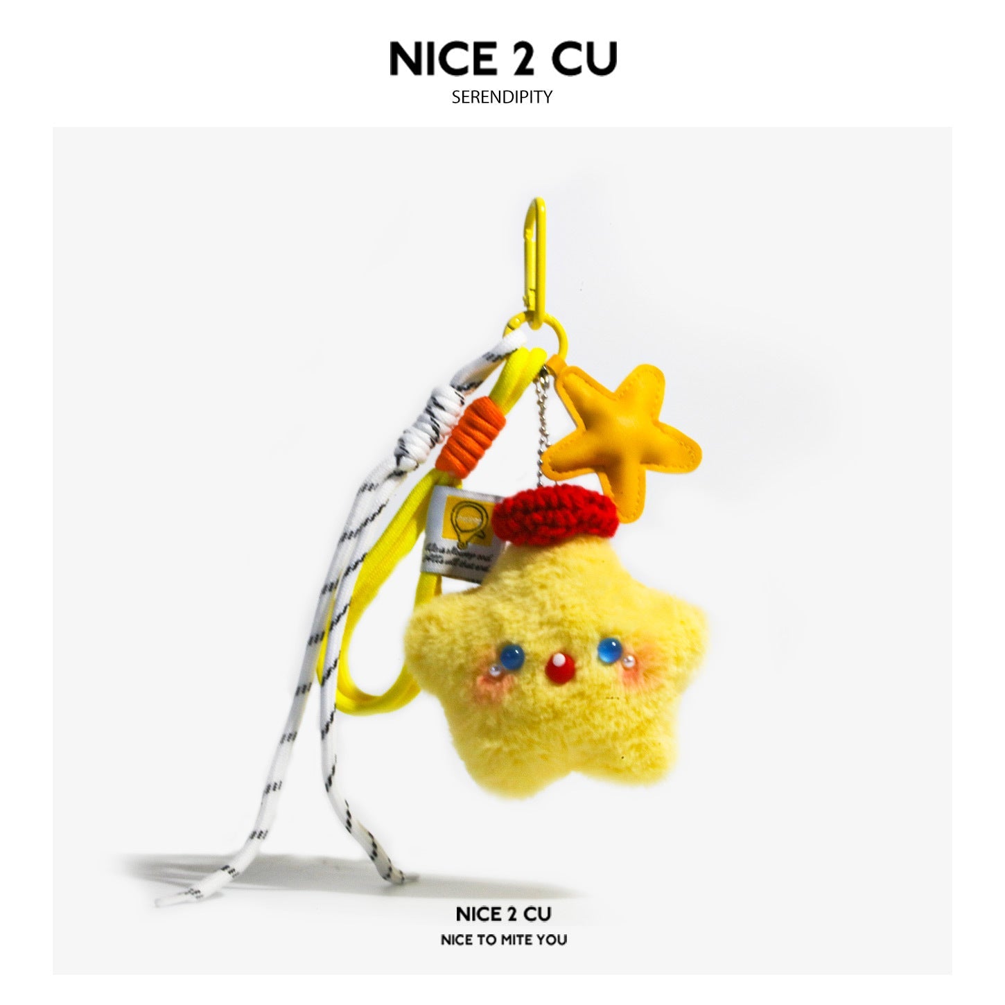 Yellow star-shaped plush charm with red knit beret, bead facial details, colorful cords, and yellow carabiner clip