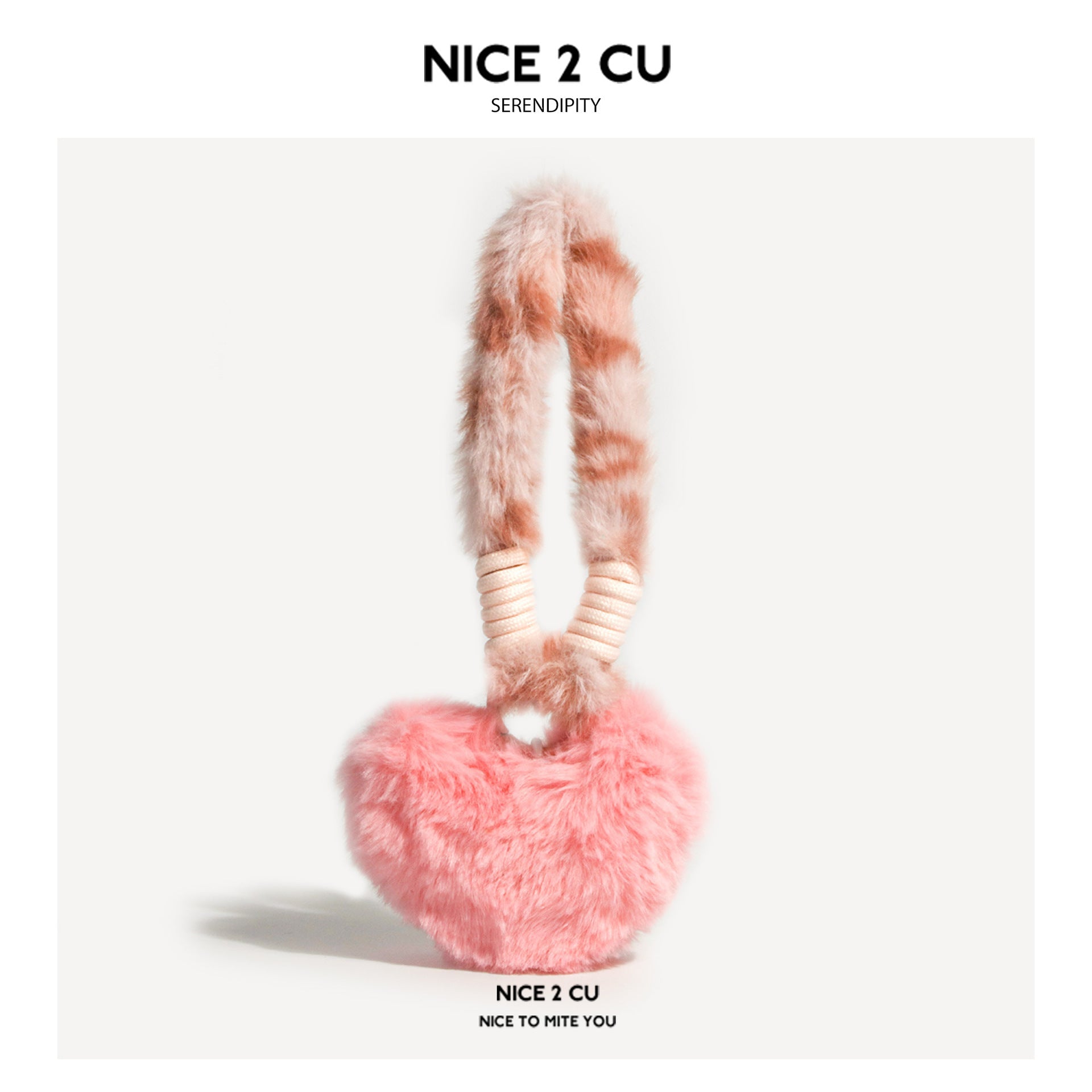 Fluffy pink heart-shaped plush bag charm with pale beige loop straps