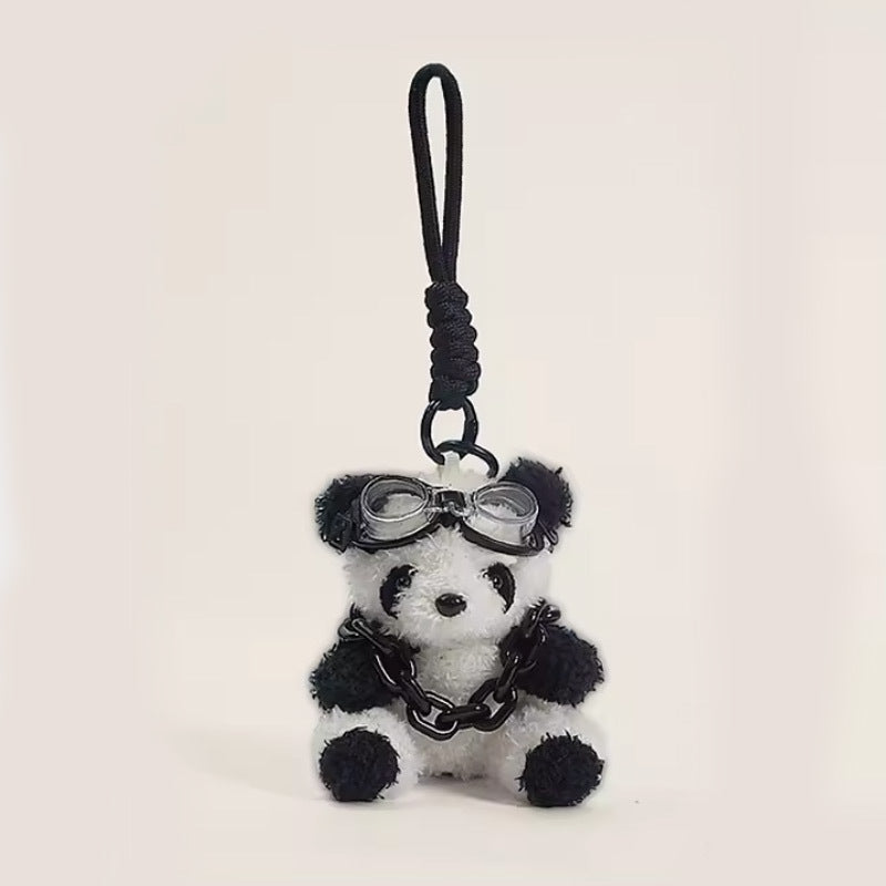 Panda plush keychain charm with black chain neck accessory and miniature goggles on braided cord