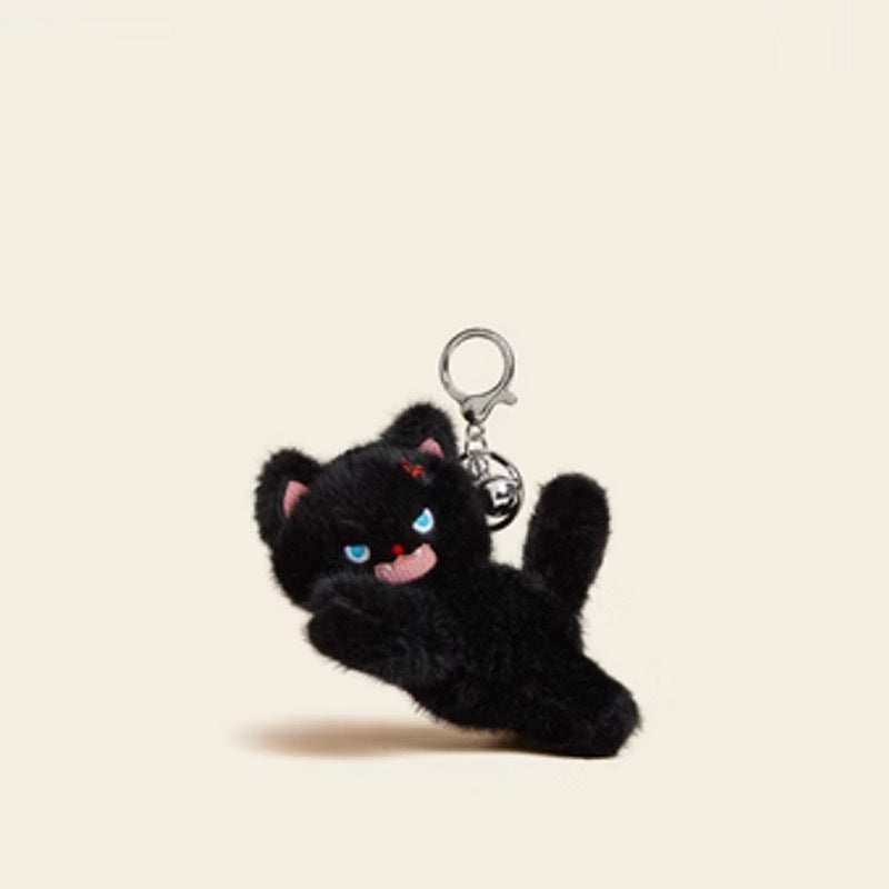Black crouching kawaii cat plush keychain charm with one paw forward, blue eyes, and silver clip hardware
