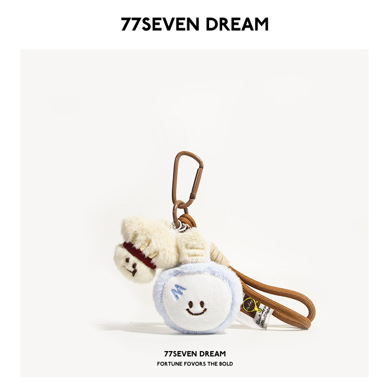 Badminton plush keychain with two ball charms and brown coffee-colored cord strap with clip
