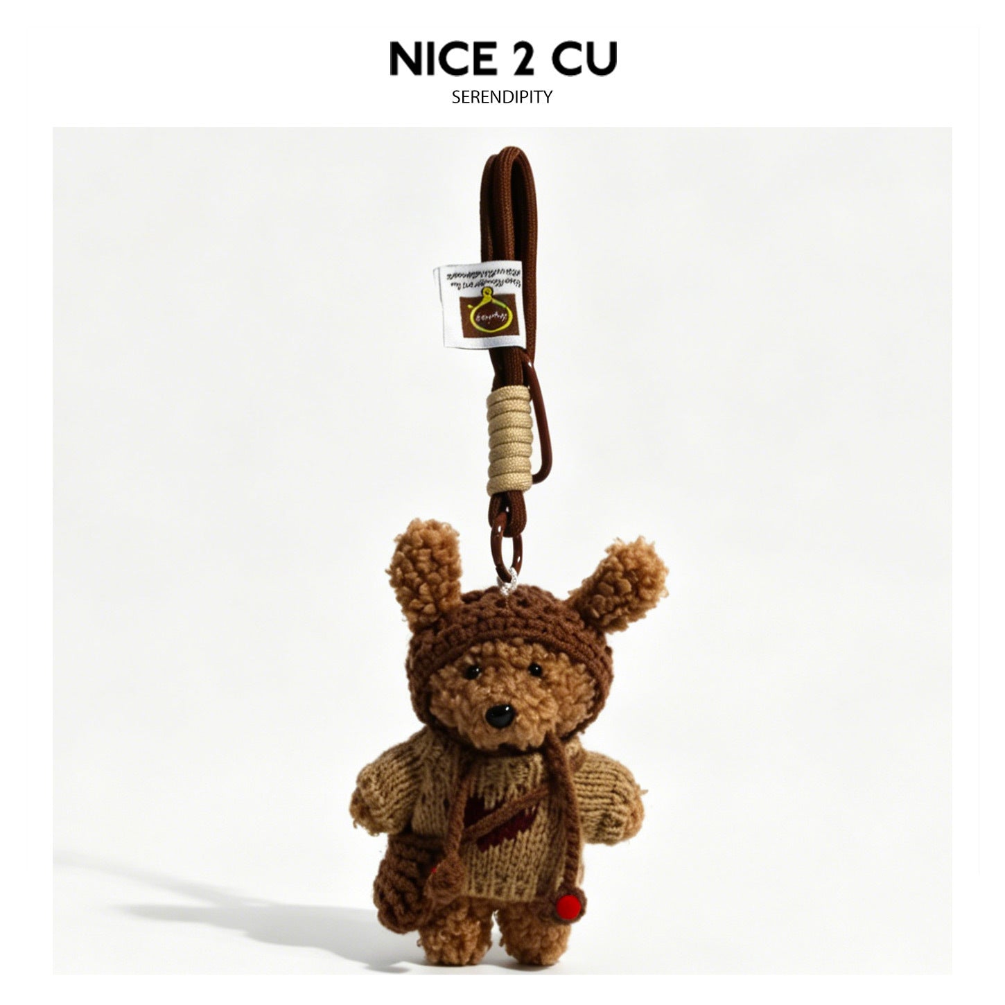 Bear plush bag charm wearing a coffee-brown knitted sweater with a red heart design on the chest and braided cord loop