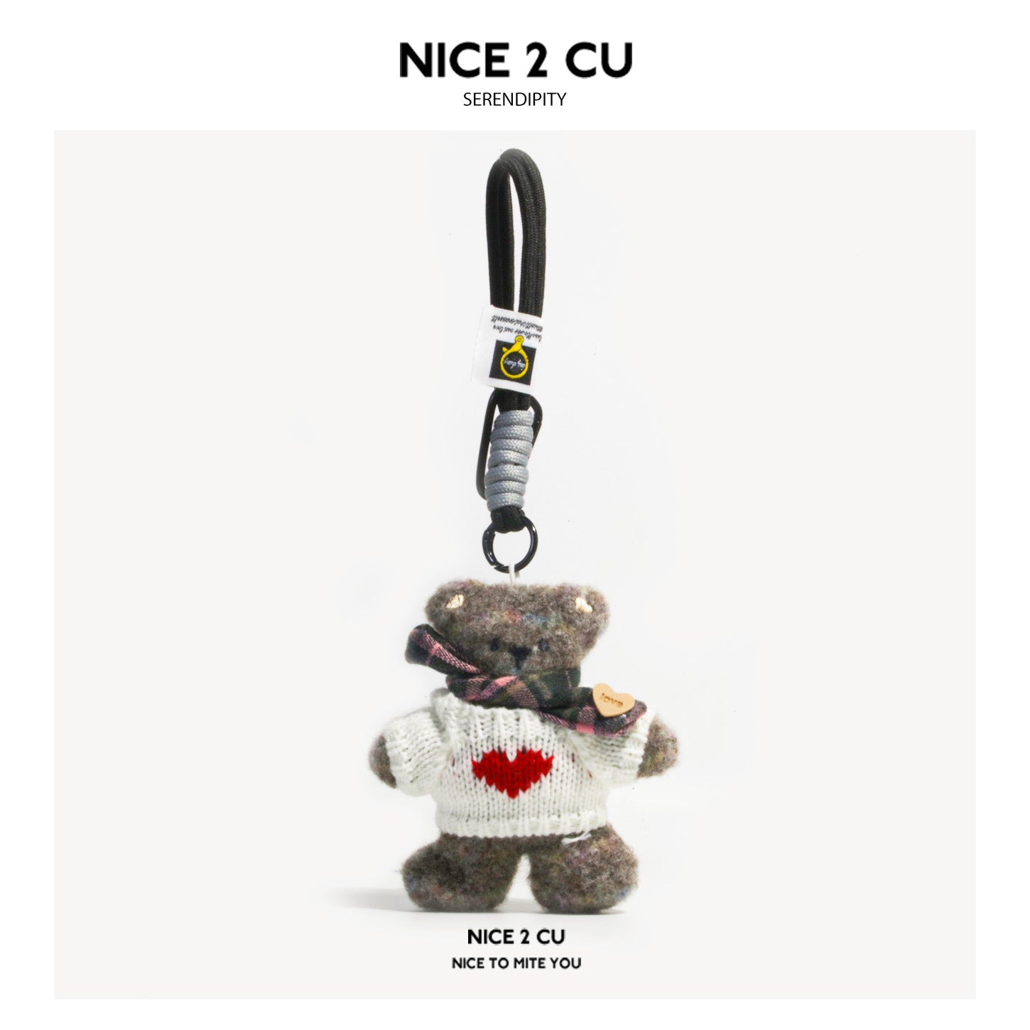 Serendipity Dirty Bear plush charm in white heart-motif sweater and plaid scarf with braided cord keychain