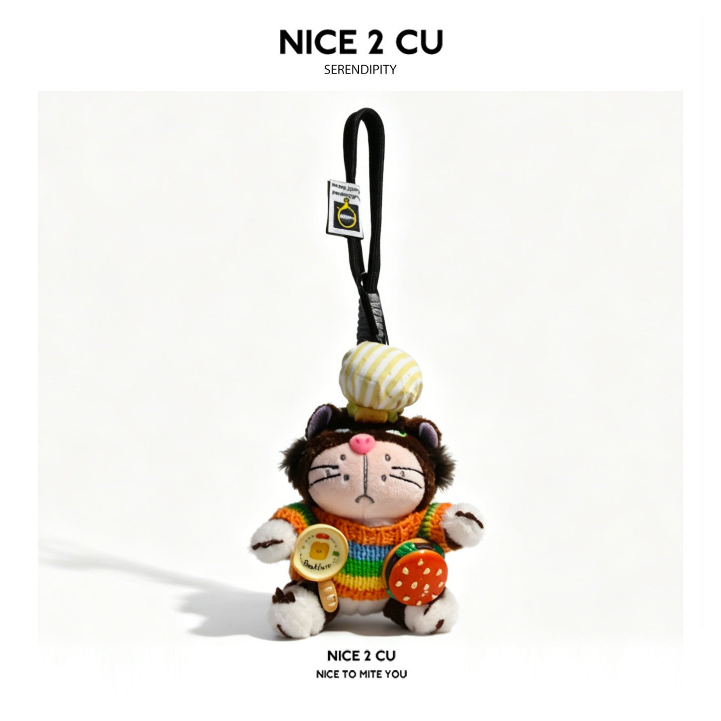 Dark brown grumpy cat plush keychain wearing a rainbow-striped sweater and holding burger and egg food props
