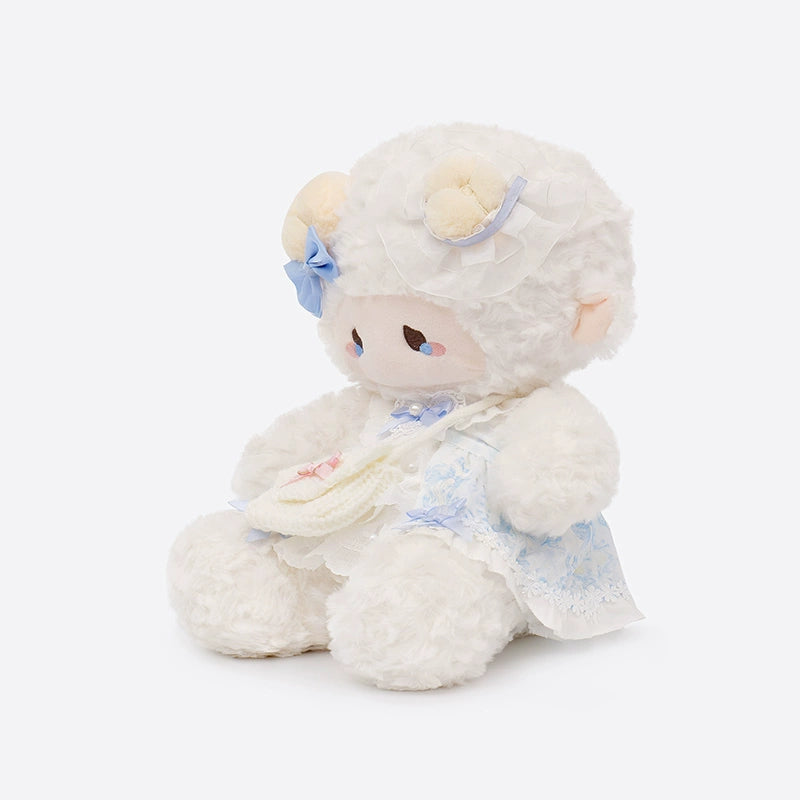 The ZEIO Dressed Lamb Plush Toy (29cm) is a soft, collectible sheep doll in a blue outfit, featuring lace and floral accents—ideal for nursery décor or as an adorable gift. Shown seated against a plain background.