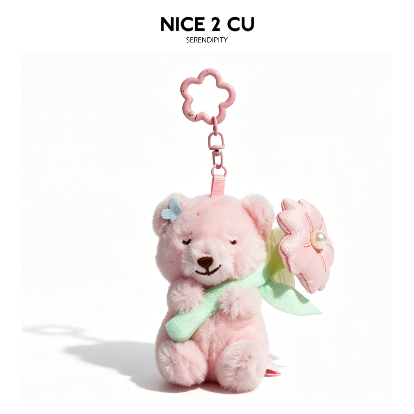 Pink plush teddy bear charm with flower bouquet, blue butterfly ear accent, and pink flower-shaped hanging clip