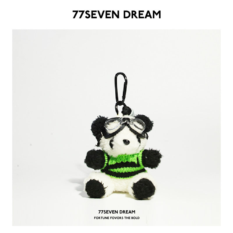 Panda charm wearing black and neon green color-block sweater with clear aviator goggles