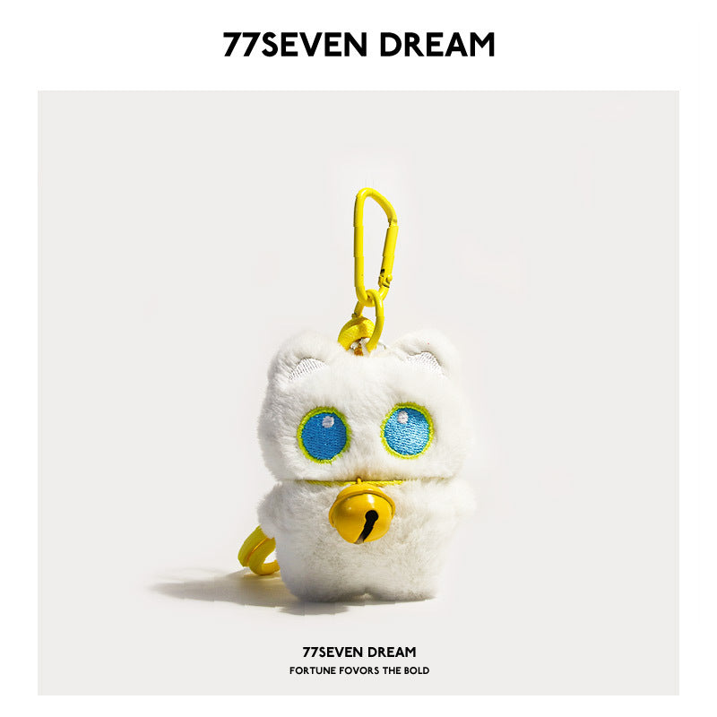 White cat plush keychain charm with blue-outlined eyes and yellow jingle bell, yellow carabiner clip