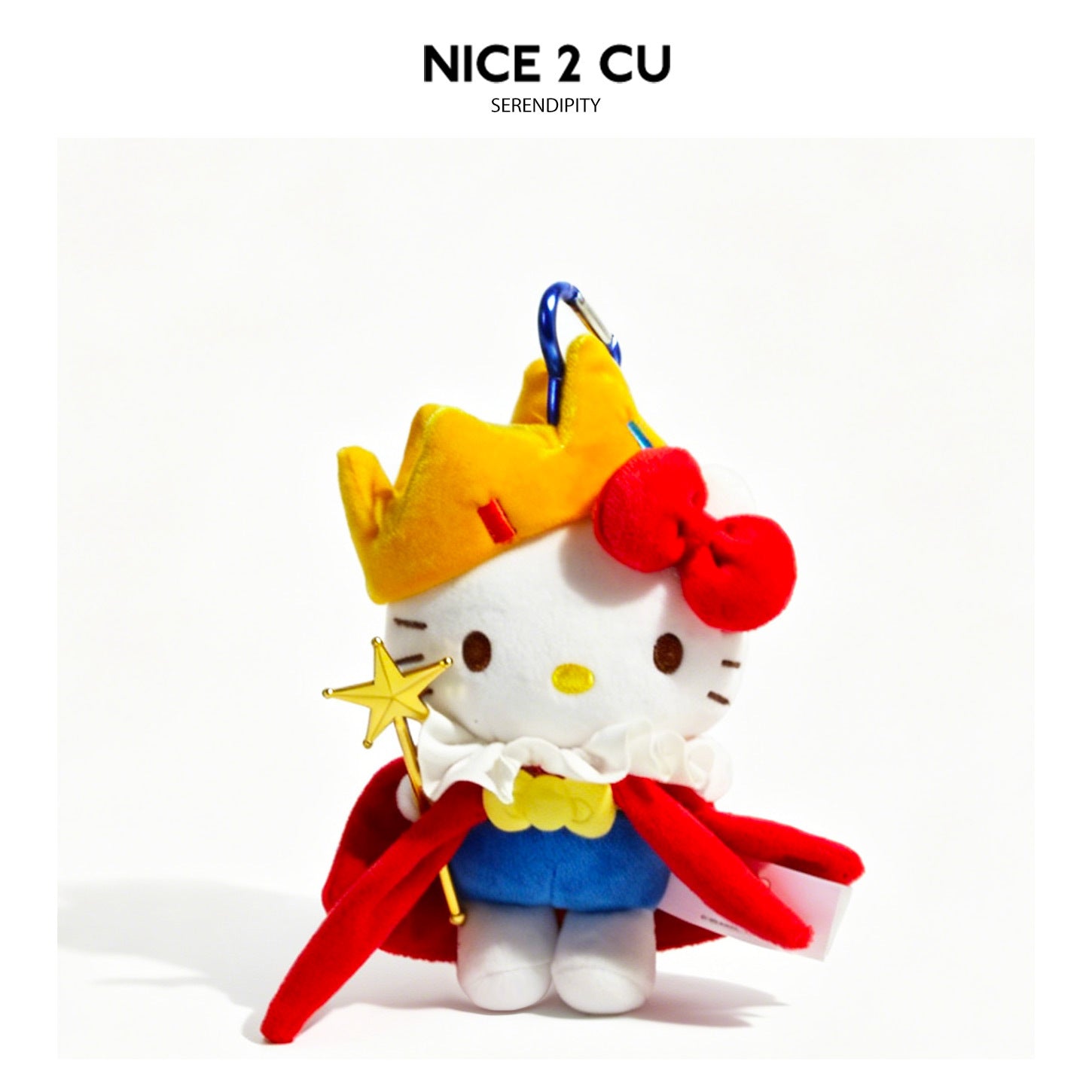 White cat plush charm dressed in Little Prince costume with yellow crown, red cape, and star-topped staff