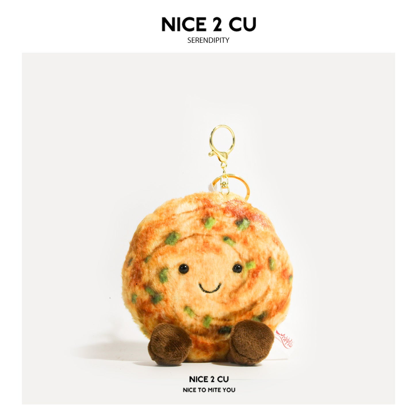 Kawaii scallion pancake plush keychain charm with swirled orange surface, green accents, smiling face, and gold-tone ring