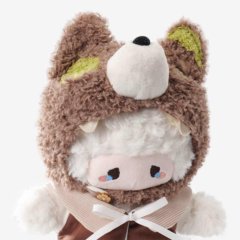 The ZEIO Sheep-Costume Lamb Plush Toy 29cm is an adorable, soft doll with a sheep face and blushing cheeks, wearing a brown bear hood with fluffy ears—perfect for nursery decoration.