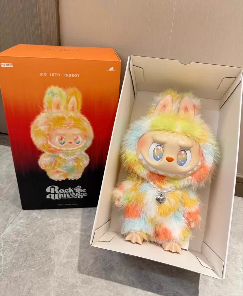 The Labubu Big into Energy Series Plush Doll (37cm) from POP MART is shown in a box next to its packaging, part of the designer collectible series.