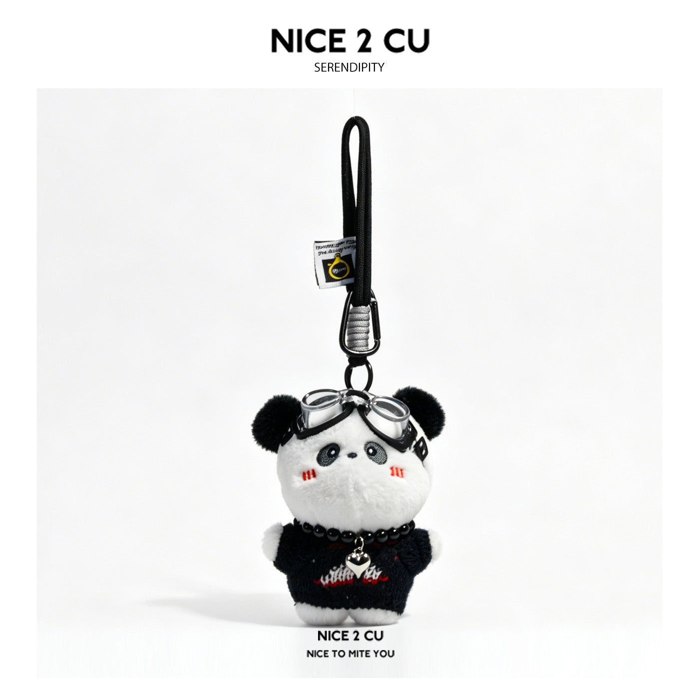Black and white panda plush bag charm with goggles and a bead necklace, hanging from a black loop strap with metal clip