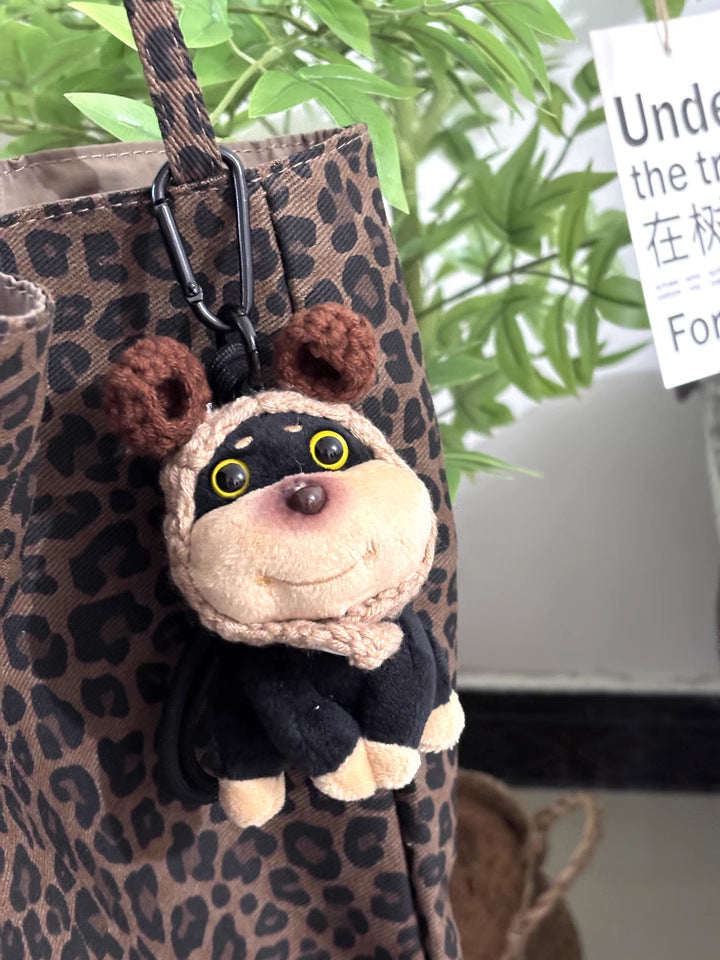Chibi dog plush keychain charm wearing a brown bear-ear hood