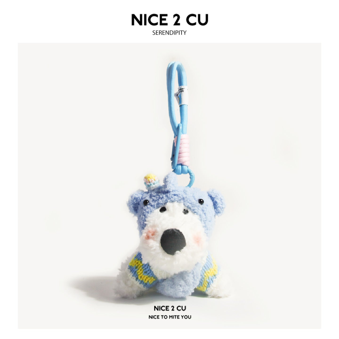 White dog plush keychain charm with blue elephant hood and blue yellow knit sweater