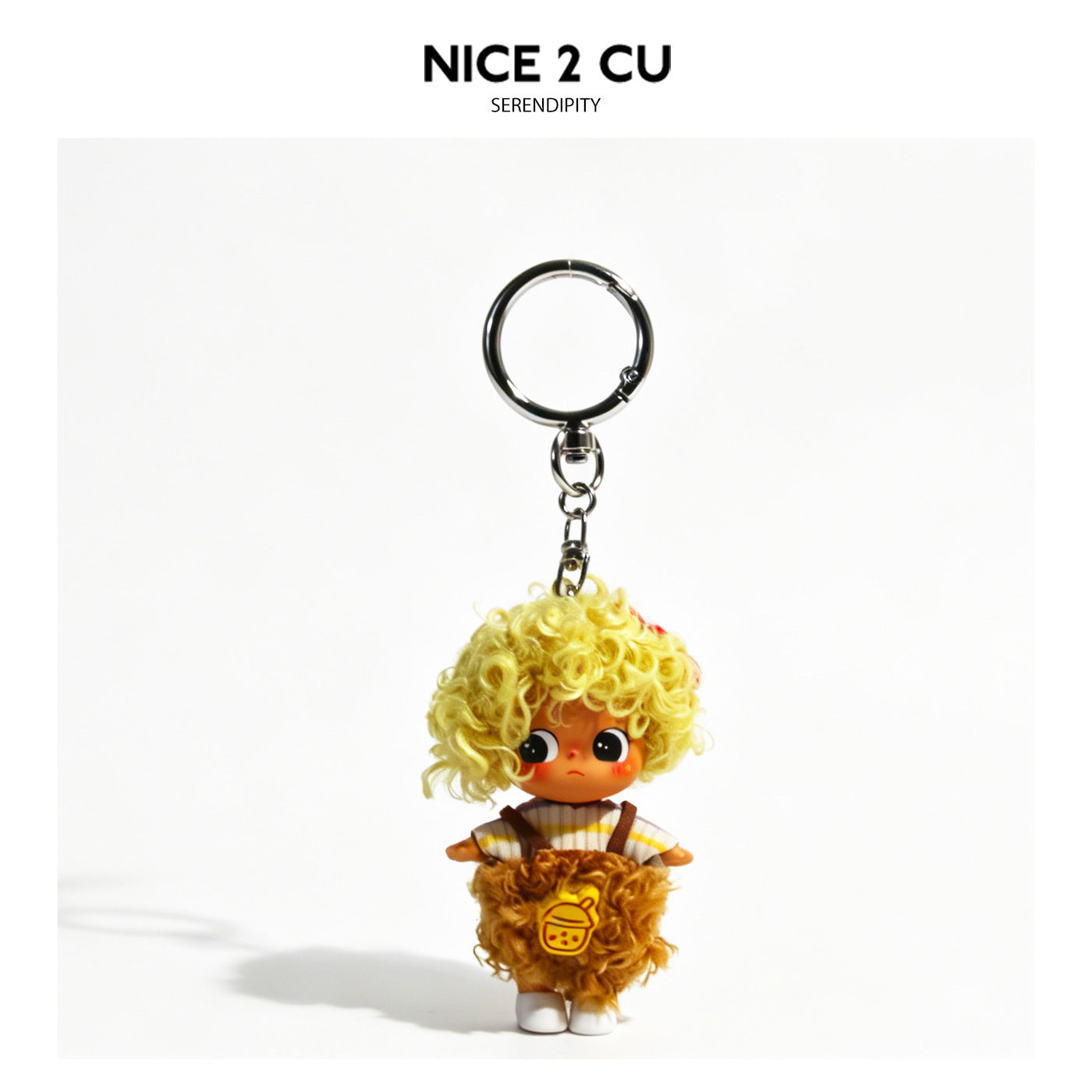 Kawaii doll keychain charm with curly yellow hair, striped top, and fluffy brown skirt with yellow emblem, attached to silver