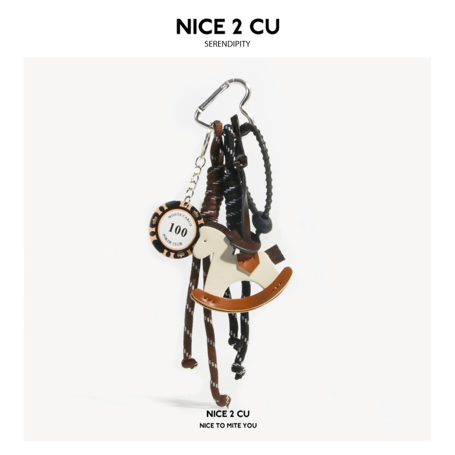 Black and brown rocking horse bag charm with braided dark cords, casino-chip disc pendant, and silver heart-shaped clasp