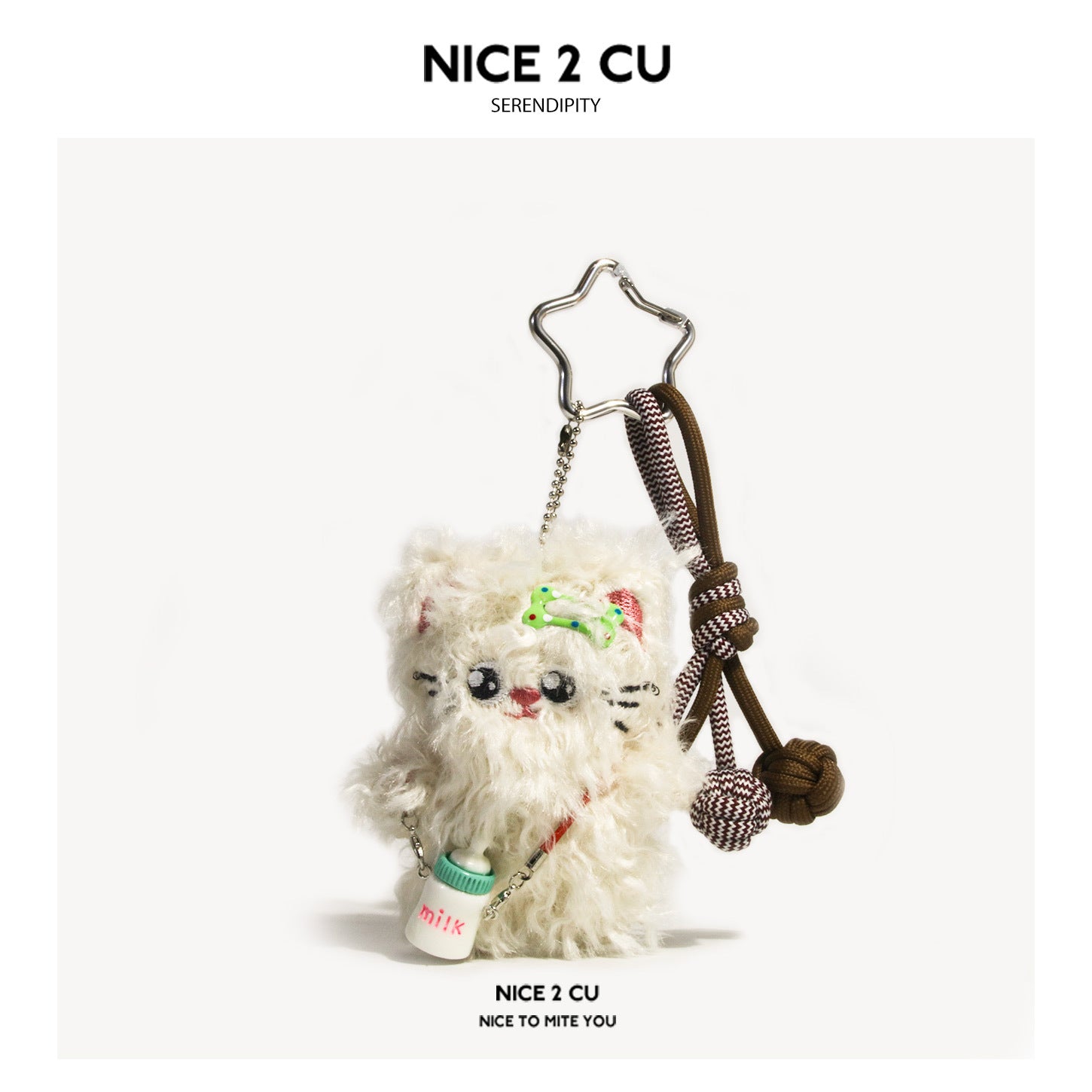 Cream white fluffy plush cat charm with star ring, braided paracord knot, and miniature milk bottle pendant