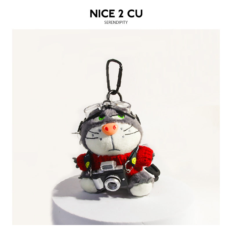 Plush cat keychain charm wearing red knitted sweater with camera accessory and clear goggles