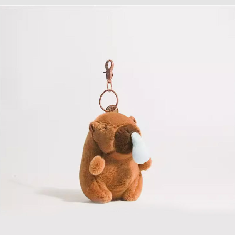 Side-view brown plush capybara keychain with a light blue nose accent and metal swivel clasp