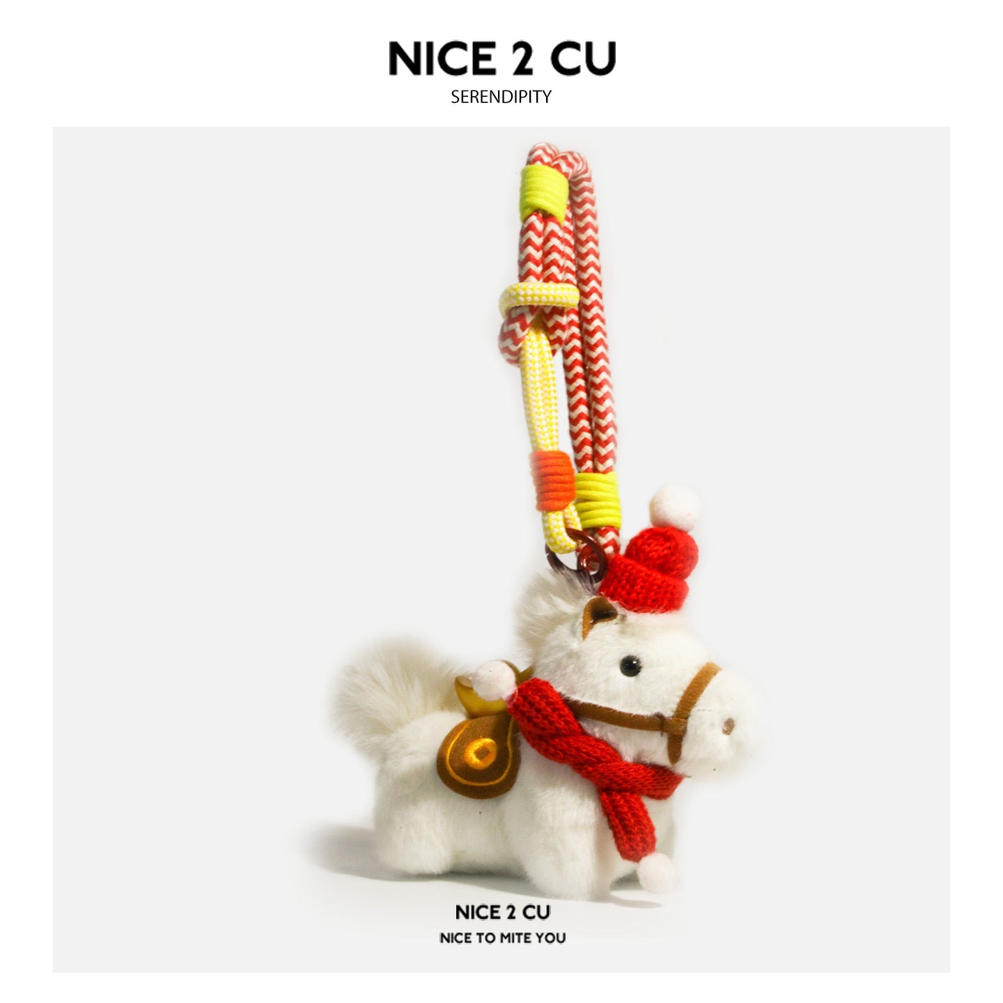 White plush horse ornament with solid red scarf, red knitted hat, and hanging cord attachment