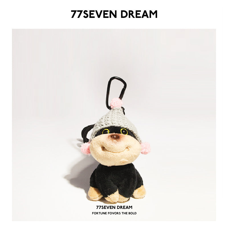 Kawaii chibi dog plush keychain charm with grey knitted hat and pink pompoms, black carabiner clip