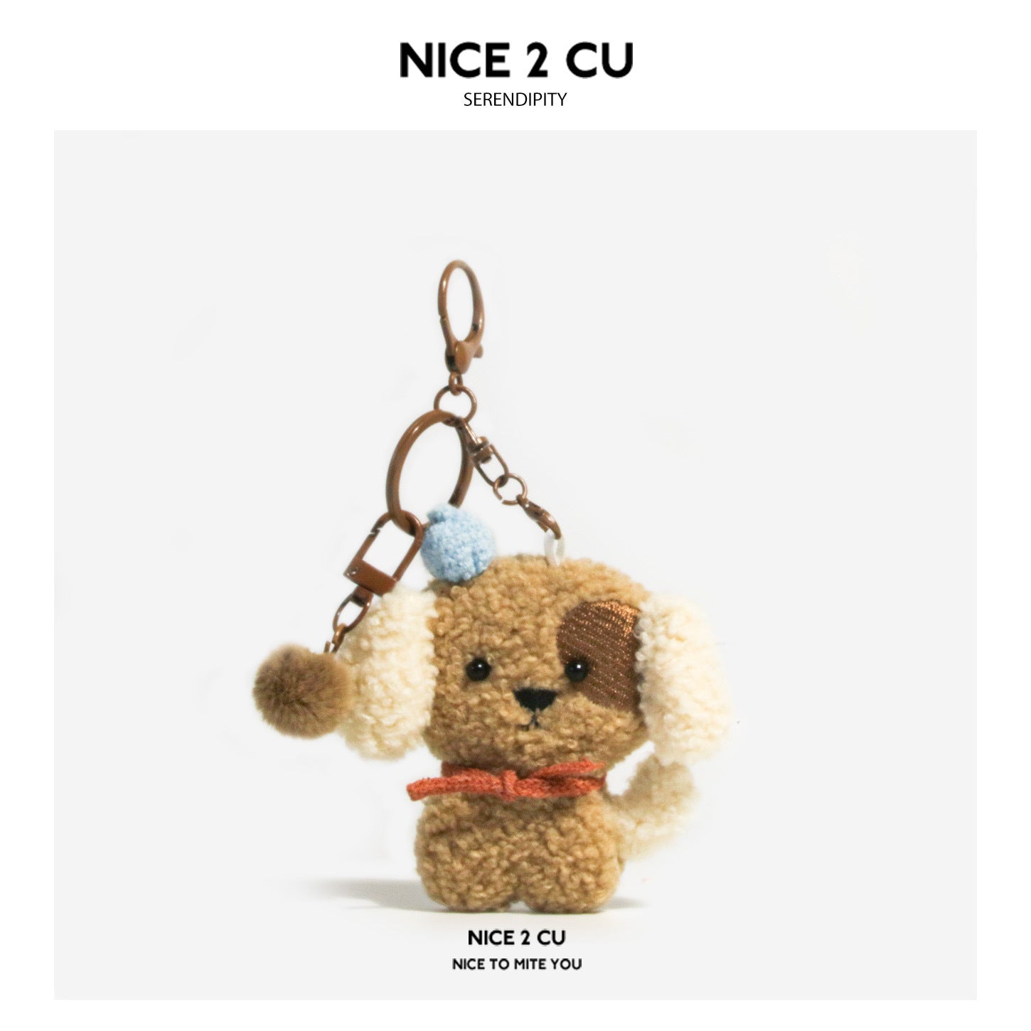 Curly brown plush dog keychain charm with red scarf and light-blue hat accent