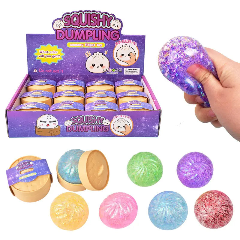 A ZoDoll display box labeled "Glitter Squishy Dumpling Sensory Fidget Toy with Steamer" features round, colorful sensory toys, one being squeezed by a hand and five different colored dumplings shown in front.