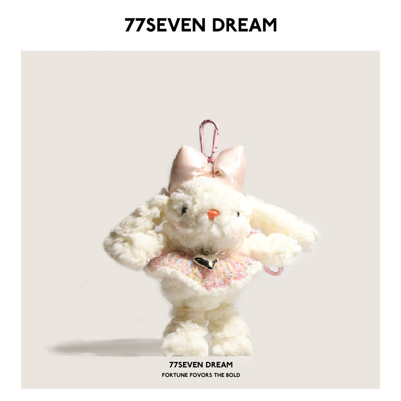 White bunny plush charm with pale pink bow and soft pink knit-style dress