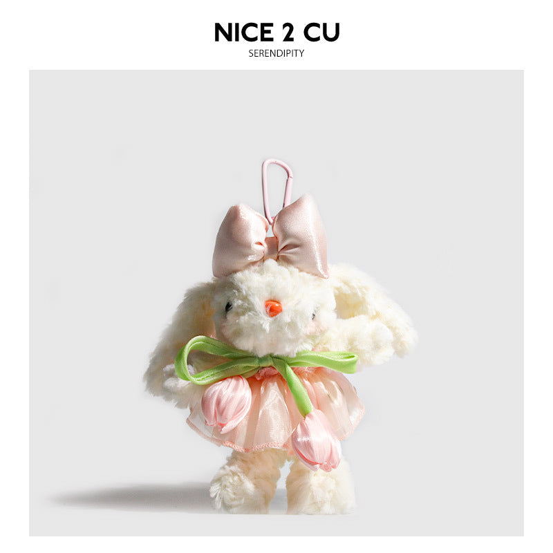 White bunny plush keychain with pink bow, green neck ribbon, and tulip-accented pink skirt