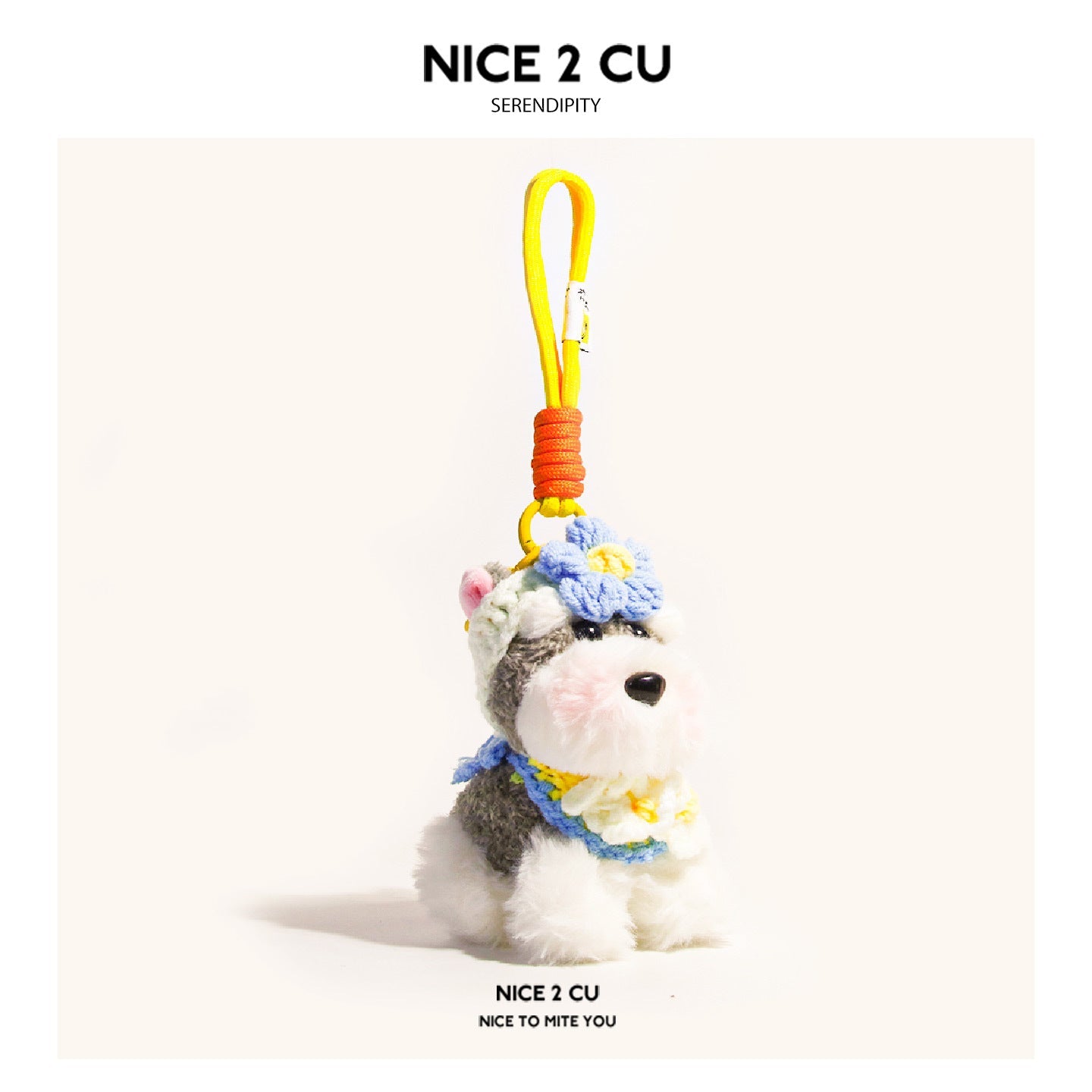 Schnauzer plush keychain with blue flower accents on head and chest, yellow hanging cord with orange wrap section