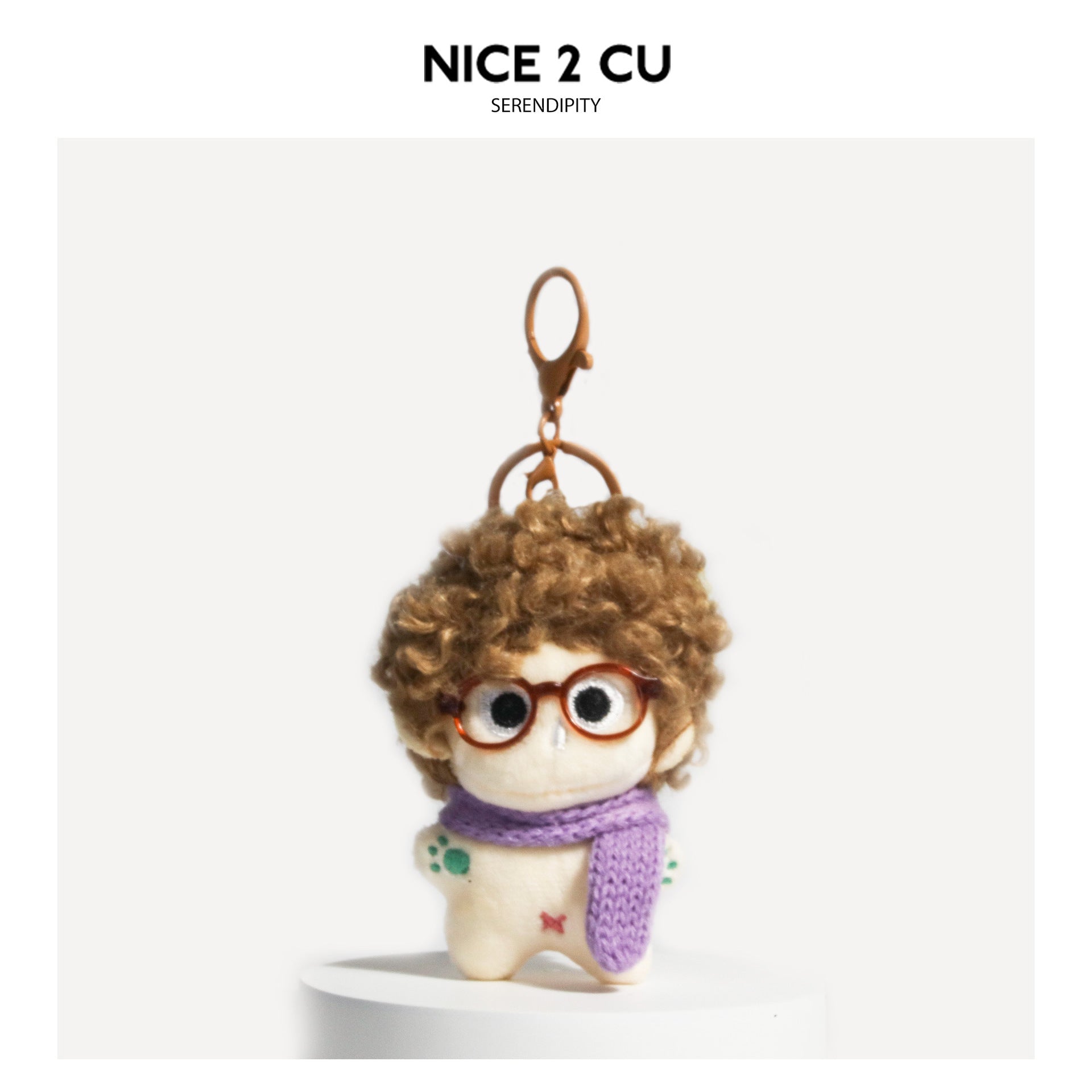 Brown curly-hair plush doll bag charm with brown glasses and purple knitted scarf, brown hanging hardware