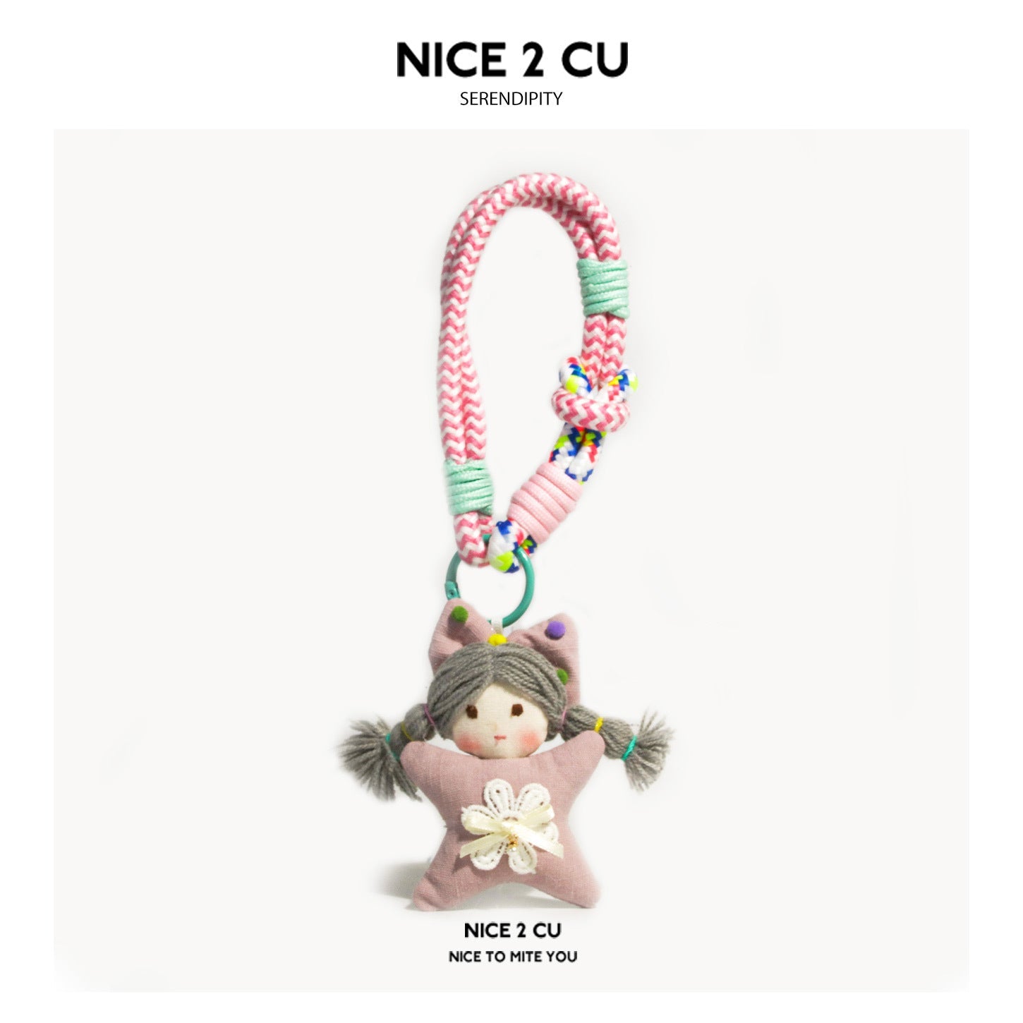 Kawaii star-shaped plush girl doll charm in dusty pink with grey yarn pigtails, floral appliqué, and pink chevron braided loo