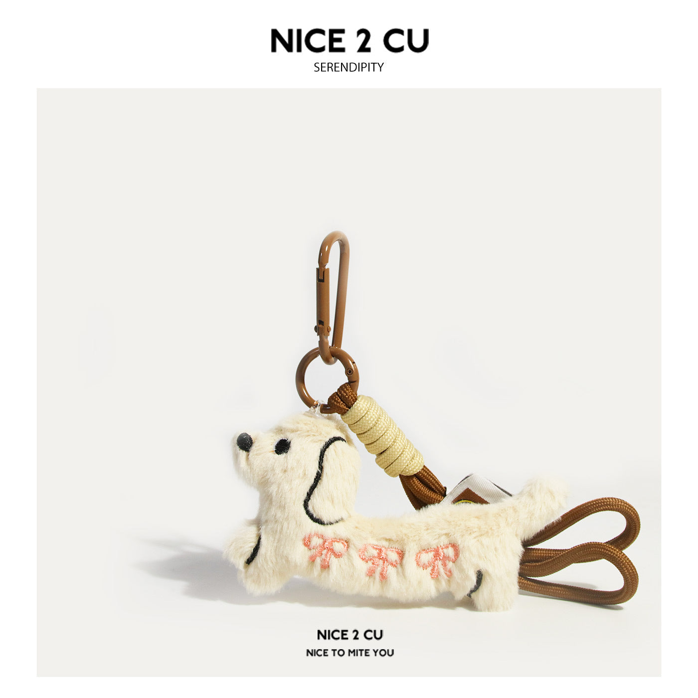 Cream dachshund plush keychain with pink bow embroidery and brown carabiner strap