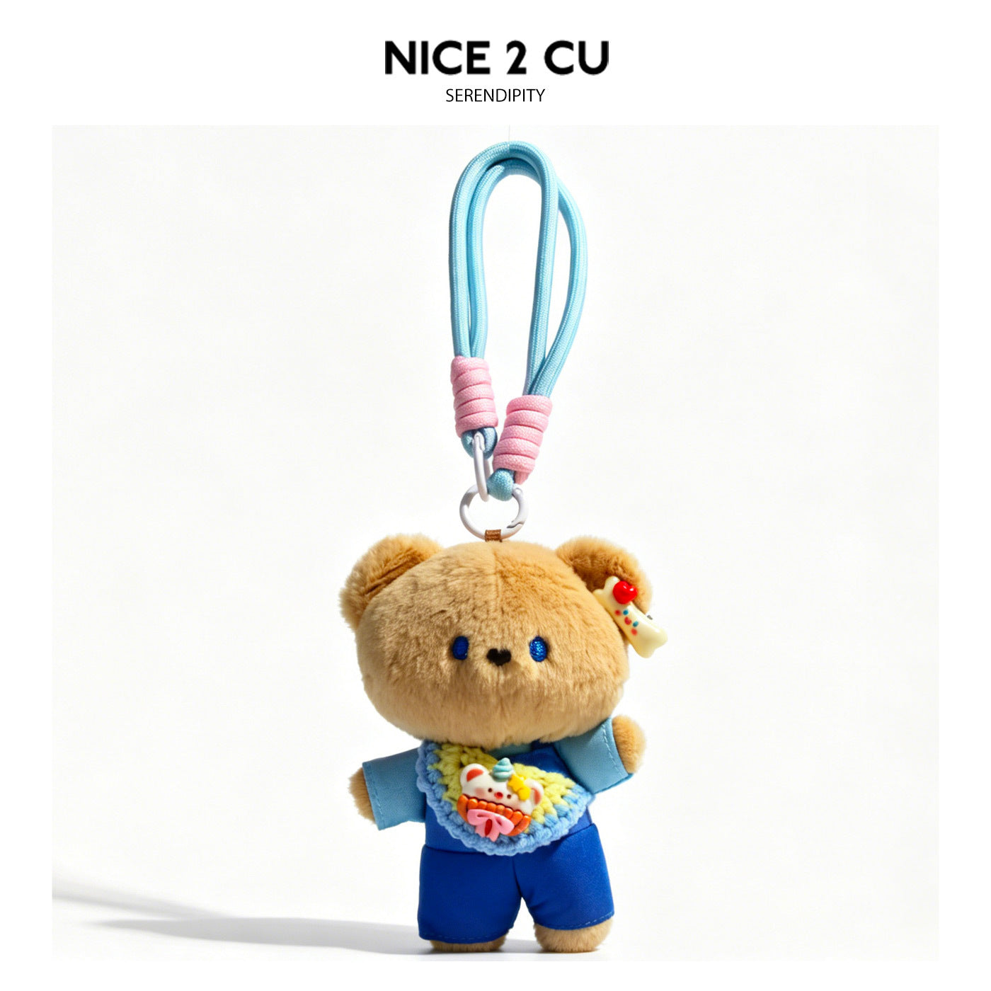 Plush brown bear charm in blue outfit with gingham crossbody bag and light blue braided loop strap