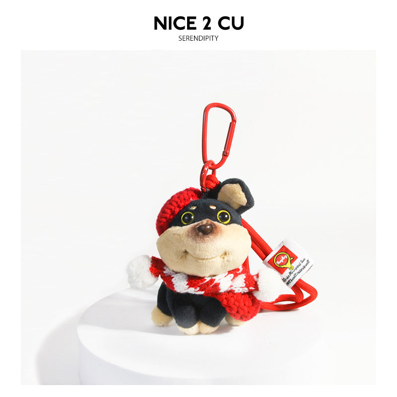 Beige plush dog keychain charm wearing a red beret and red-and-white outfit with red carabiner clip