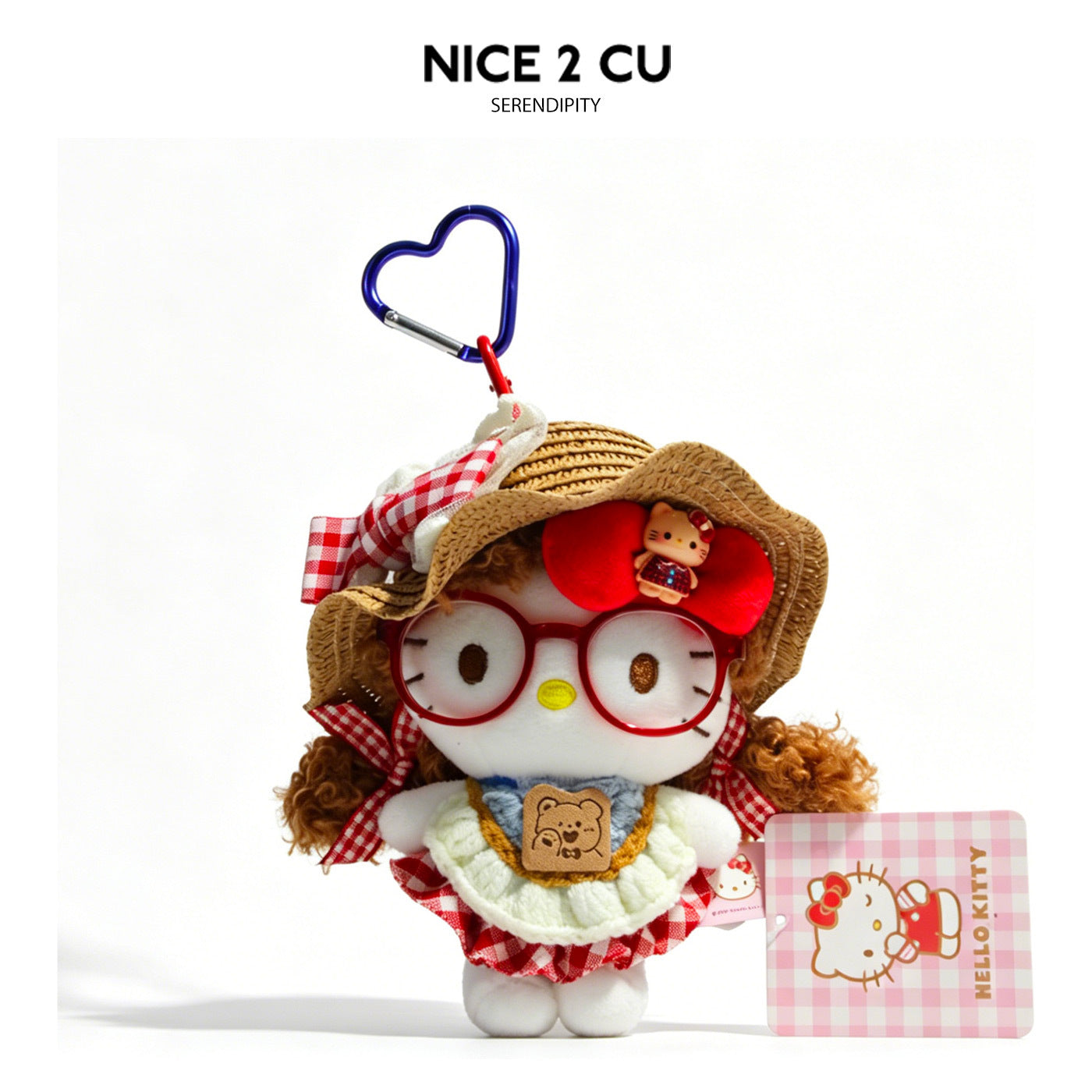 Hello Kitty plush charm with brown curly hair, straw hat, red gingham outfit, and blue heart carabiner clip